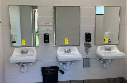 hand washing decals on three sinks